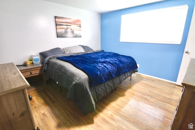 3223 S Fairlane St, Magna, UT 84044 - bedroom with baseboards and wood finished floors
