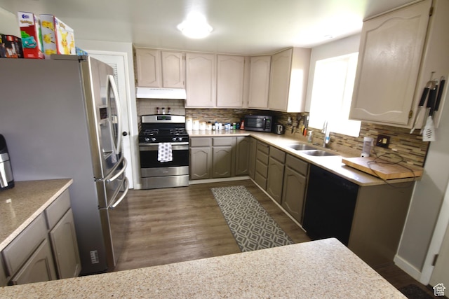 3223 S Fairlane St, Magna, UT 84044 - kitchen with under cabinet range hood, stainless steel appliances, decorative backsplash, and a sink