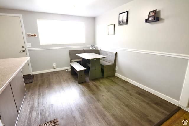 3223 S Fairlane St, Magna, UT 84044 - dining room featuring baseboards and dark wood-style floors