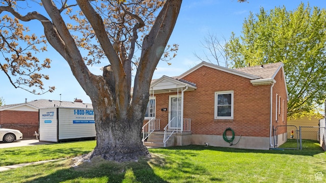278 S 750 E, Clearfield, UT 84015 - bungalow with a gate, fence, brick siding, and a front yard