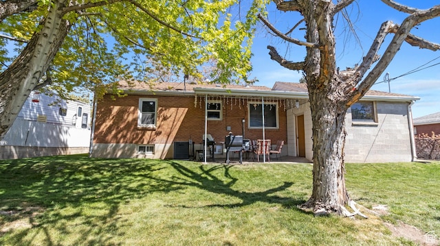 278 S 750 E, Clearfield, UT 84015 - back of house with a patio, brick siding, and a lawn