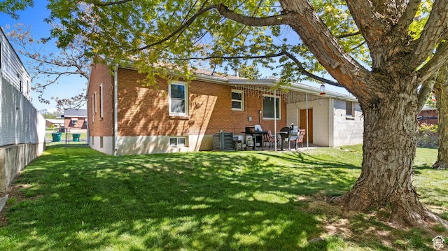 278 S 750 E, Clearfield, UT 84015 - back of house with a patio, brick siding, and a lawn