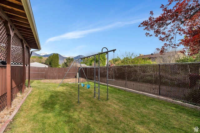 2363 W 960 N, Provo, UT 84601 - view of yard featuring a fenced backyard, a mountain view, and a playground