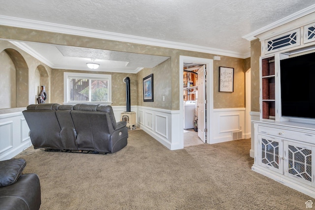 2363 W 960 N, Provo, UT 84601 - living area featuring visible vents, washer / dryer, a wood stove, and a decorative wall