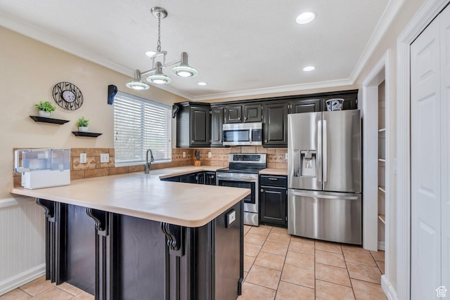 2363 W 960 N, Provo, UT 84601 - kitchen with appliances with stainless steel finishes, a sink, light countertops, a peninsula, and ornamental molding