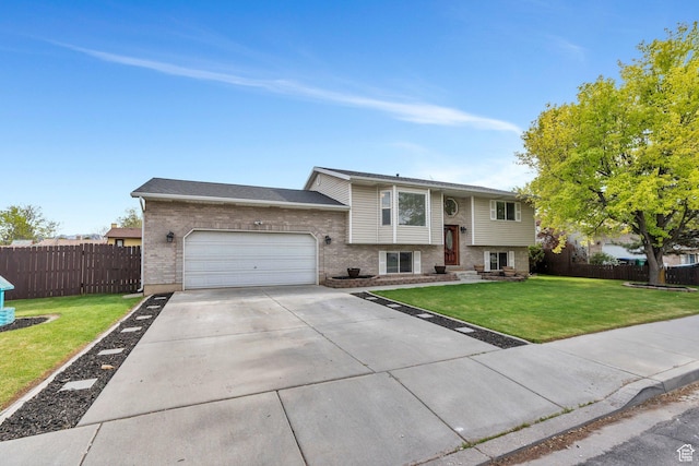 2363 W 960 N, Provo, UT 84601 - split foyer home with brick siding, an attached garage, and fence