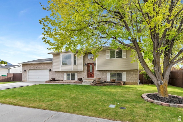 2363 W 960 N, Provo, UT 84601 - bi-level home featuring brick siding, a garage, a front lawn, and fence
