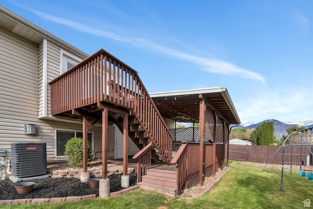 2363 W 960 N, Provo, UT 84601 - back of house with a lawn, central air condition unit, fence, a deck with mountain view, and stairs