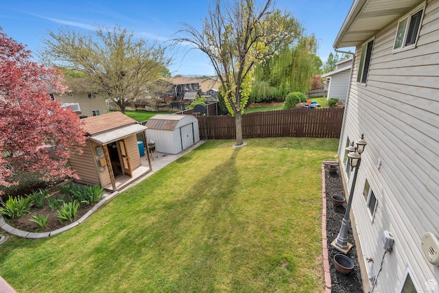 2363 W 960 N, Provo, UT 84601 - view of yard with an outdoor structure, fence, a residential view, and a shed