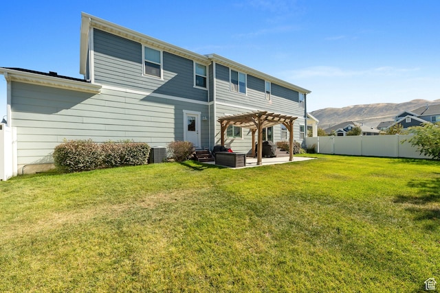 15176 S Battle Dr, Bluffdale, UT 84065 - back of property featuring a pergola, a fenced backyard, a mountain view, a lawn, and a patio