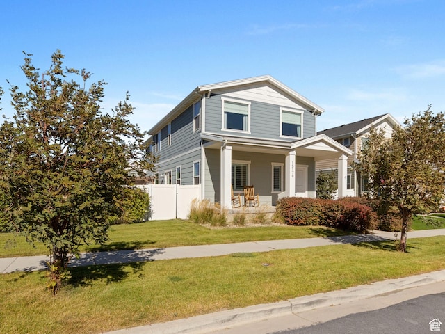 15176 S Battle Dr, Bluffdale, UT 84065 - view of front of house featuring a porch, fence, and a front lawn