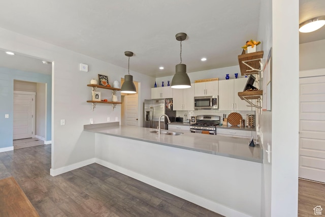 15176 S Battle Dr, Bluffdale, UT 84065 - kitchen with open shelves, a peninsula, tasteful backsplash, a sink, and appliances with stainless steel finishes