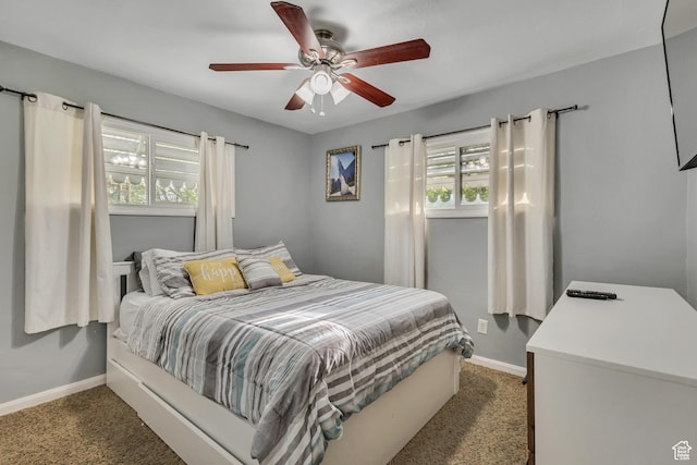 133 E 7th St S, Ogden, UT 84404 - bedroom featuring baseboards, multiple windows, light carpet, and ceiling fan