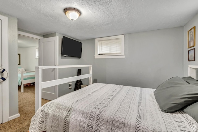 133 E 7th St S, Ogden, UT 84404 - carpeted bedroom featuring a textured ceiling