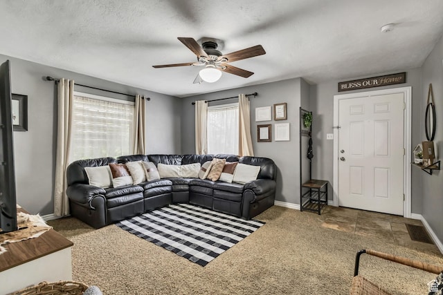 133 E 7th St S, Ogden, UT 84404 - living area featuring baseboards, a ceiling fan, and carpet flooring