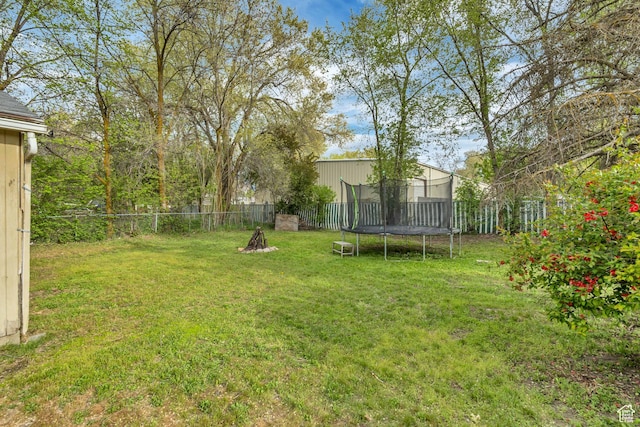 133 E 7th St S, Ogden, UT 84404 - view of yard with a fenced backyard and a trampoline