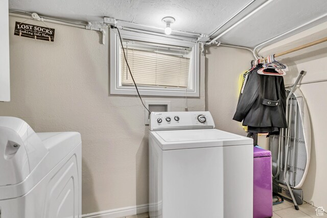 133 E 7th St S, Ogden, UT 84404 - clothes washing area with light tile patterned floors, laundry area, and washer and clothes dryer