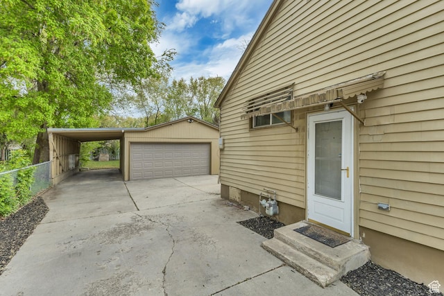 133 E 7th St S, Ogden, UT 84404 - view of side of property featuring driveway, fence, and an outdoor structure