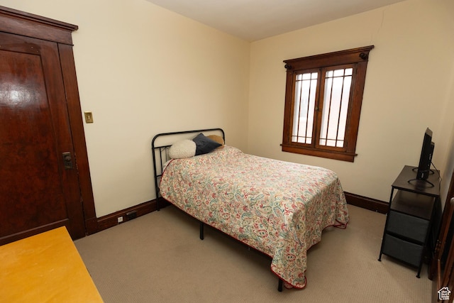 970 E Wilson Ave S, Salt Lake City, UT 84105 - bedroom with baseboards and light carpet