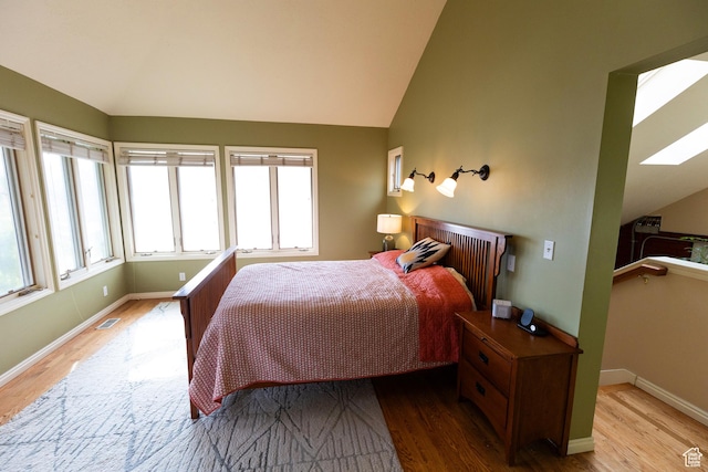 970 E Wilson Ave S, Salt Lake City, UT 84105 - bedroom with vaulted ceiling, wood finished floors, baseboards, and a skylight