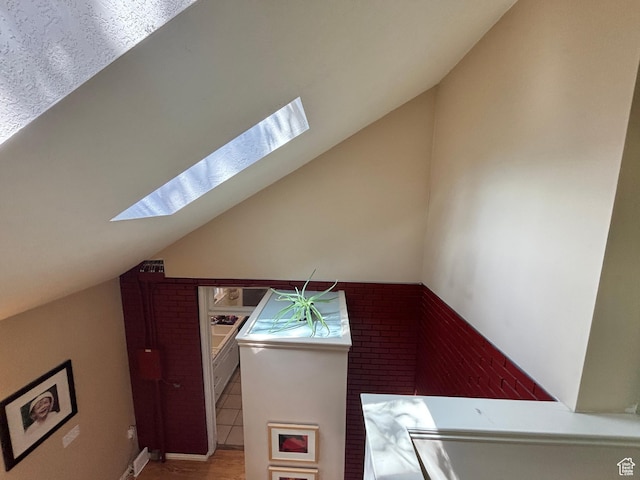 970 E Wilson Ave S, Salt Lake City, UT 84105 - bonus room with a skylight, lofted ceiling, and wood finished floors