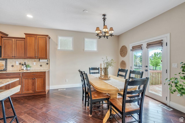 2797 W Fox Hunters Loop, Lehi, UT 84043 - dining space with an inviting chandelier, french doors, recessed lighting, baseboards, and dark wood-style floors