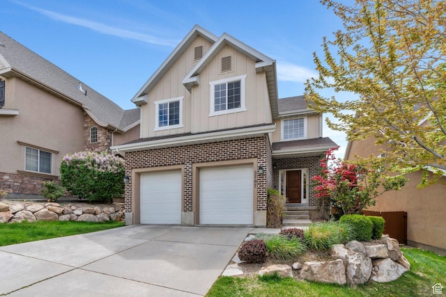 traditional home featuring roof with shingles, an attached garage, brick siding, board and batten siding, and concrete driveway