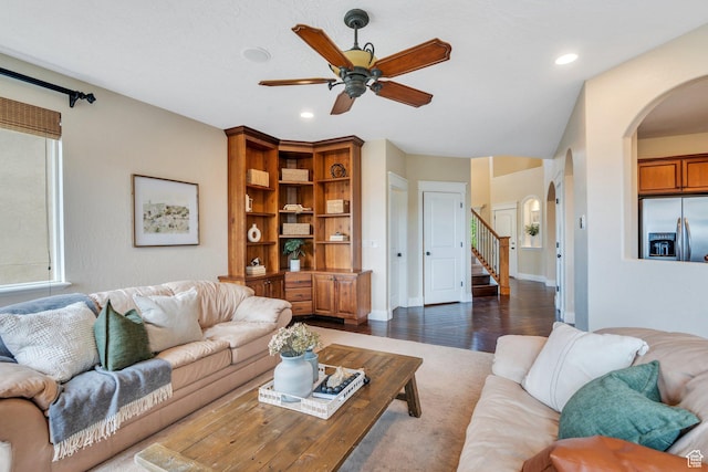 2797 W Fox Hunters Loop, Lehi, UT 84043 - living room featuring ceiling fan, dark wood-style flooring, arched walkways, stairs, and recessed lighting
