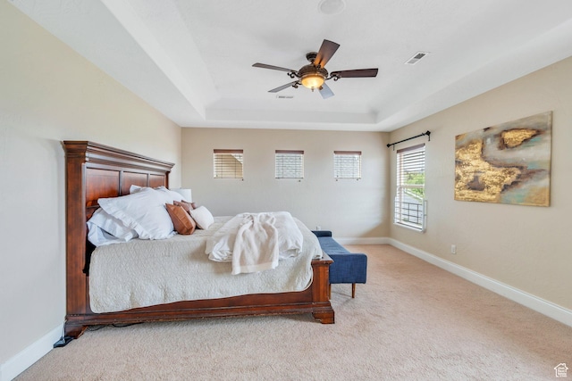 2797 W Fox Hunters Loop, Lehi, UT 84043 - bedroom featuring visible vents, baseboards, a tray ceiling, and light colored carpet