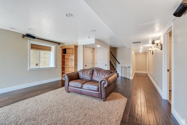 2797 W Fox Hunters Loop, Lehi, UT 84043 - living room with baseboards, visible vents, dark wood-style floors, and stairway