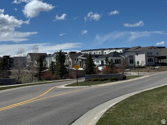 6495 Serviceberry Dr Unit B208, Park City, UT 84098 - view of street featuring a residential view, sidewalks, traffic signs, and curbs
