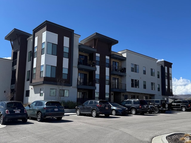 6495 Serviceberry Dr Unit B208, Park City, UT 84098 - view of building exterior with uncovered parking
