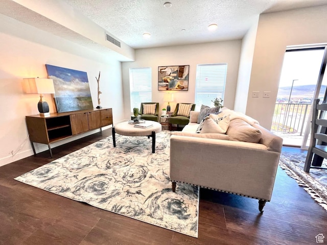 6495 Serviceberry Dr Unit B208, Park City, UT 84098 - living room featuring visible vents, a textured ceiling, wood finished floors, and a wealth of natural light