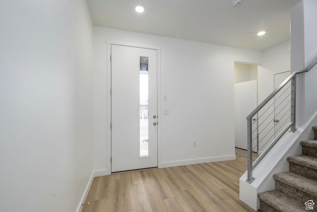 246 E Wasatch Ave Unit 201, Midvale, UT 84070 - foyer entrance with healthy amount of natural light, light wood-type flooring, stairway, baseboards, and recessed lighting