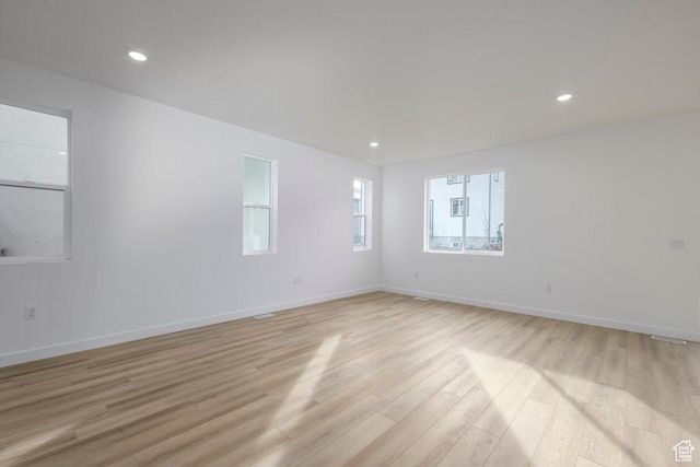 246 E Wasatch Ave Unit 201, Midvale, UT 84070 - spare room featuring light wood finished floors, recessed lighting, and baseboards