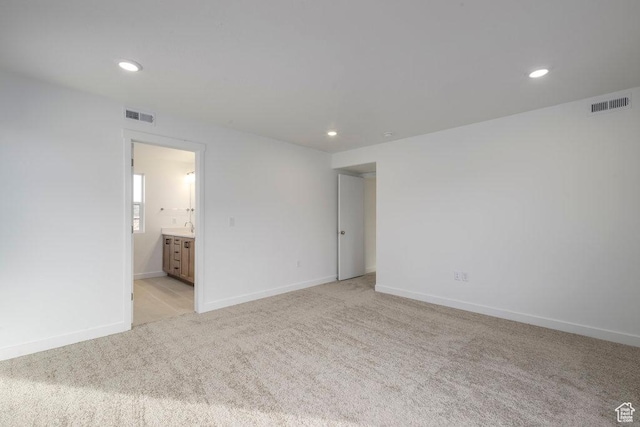 246 E Wasatch Ave Unit 201, Midvale, UT 84070 - unfurnished room featuring light carpet, recessed lighting, and baseboards