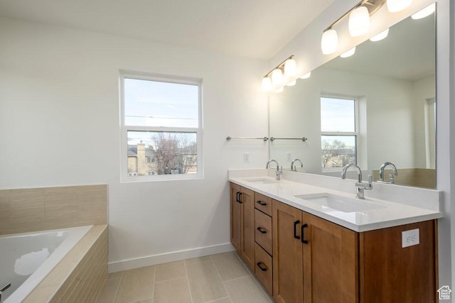 246 E Wasatch Ave Unit 201, Midvale, UT 84070 - full bath featuring baseboards, double vanity, tile patterned floors, and a relaxing tiled tub