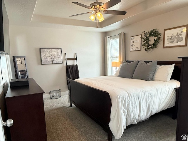 1196 W Zenith Cir, Saratoga Springs, UT 84045 - carpeted bedroom featuring a ceiling fan, a tray ceiling, and baseboards