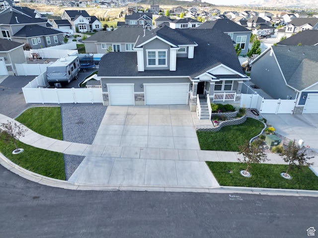 1196 W Zenith Cir, Saratoga Springs, UT 84045 - view of front of house with a gate, a residential view, driveway, and an attached garage