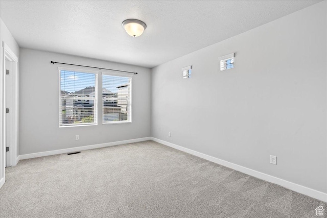 4264 W Abbey Bend Ln, Herriman, UT 84096 - carpeted empty room featuring baseboards and a textured ceiling