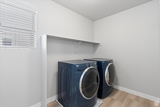4264 W Abbey Bend Ln, Herriman, UT 84096 - laundry area featuring washer and clothes dryer, light wood-style floors, and baseboards