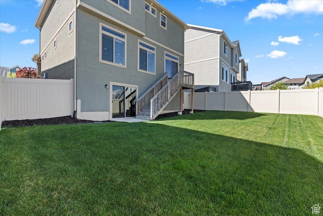 4264 W Abbey Bend Ln, Herriman, UT 84096 - rear view of house with stairs and stucco siding