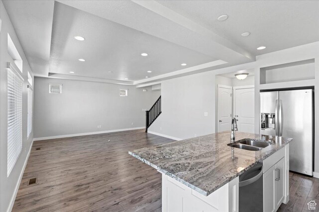 4264 W Abbey Bend Ln, Herriman, UT 84096 - kitchen featuring appliances with stainless steel finishes, a raised ceiling, a sink, dark wood-type flooring, and recessed lighting