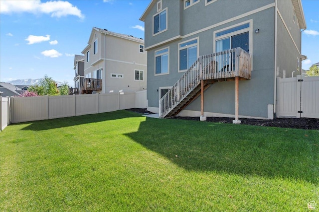 4264 W Abbey Bend Ln, Herriman, UT 84096 - rear view of house featuring stairway, stucco siding, and a wooden deck