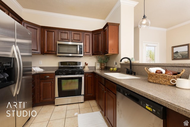 kitchen with appliances with stainless steel finishes, a sink, decorative light fixtures, light tile patterned floors, and ornamental molding