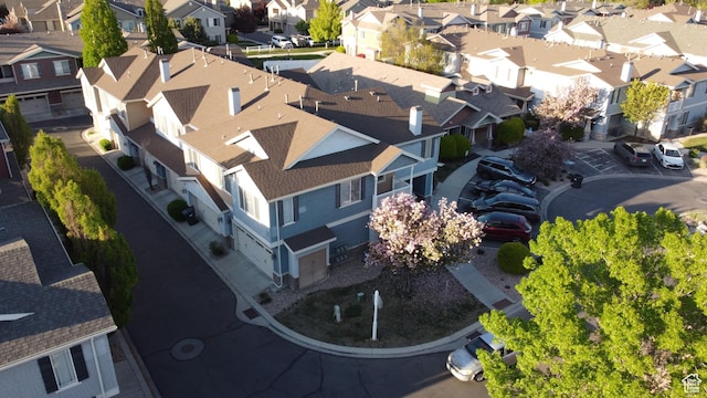 birds eye view of property with a residential view