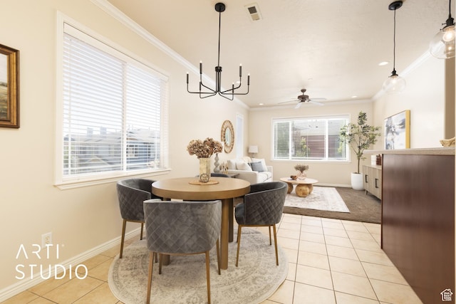 dining area with visible vents, ornamental molding, baseboards, and light tile patterned flooring