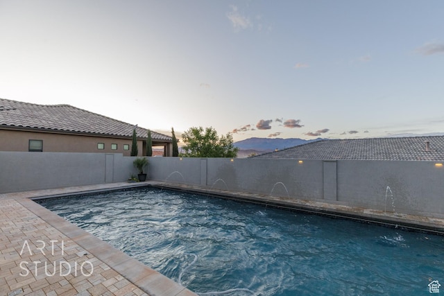 3658 W 2510 S, Hurricane, UT 84737 - pool at dusk featuring a fenced in pool and a fenced backyard