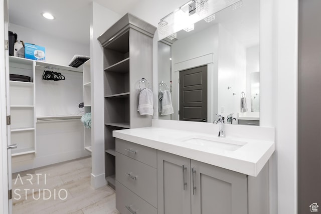 3658 W 2510 S, Hurricane, UT 84737 - bathroom with a spacious closet, vanity, and wood finished floors