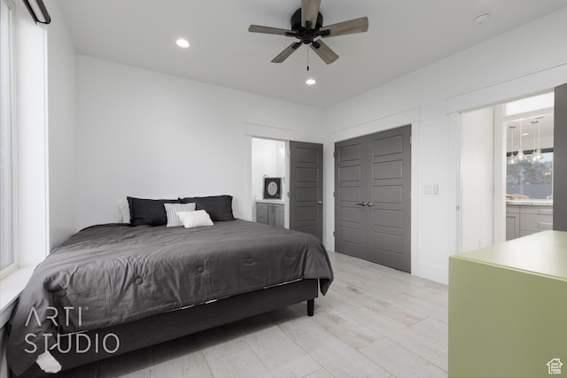 3658 W 2510 S, Hurricane, UT 84737 - bedroom featuring connected bathroom, light wood-style floors, ceiling fan, and recessed lighting